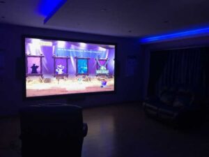 Epson EH-TW9400 projector installed, projecting vibrant and high-contrast visuals on a screen.