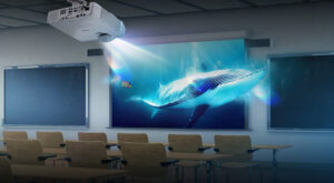 The Epson EB-L210SW projector displaying bright visuals in a modern classroom.